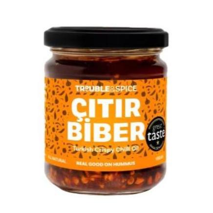 Jar of Trouble & Spice Çıtır Biber, a Turkish crispy chilli oil (chili olie) with an orange label and black lid, featuring a Great Taste award badge.