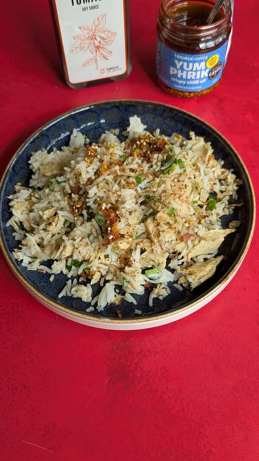 Chicken fried rice with yum phrik thai crispy chilli oil and rival foods pulled chicken